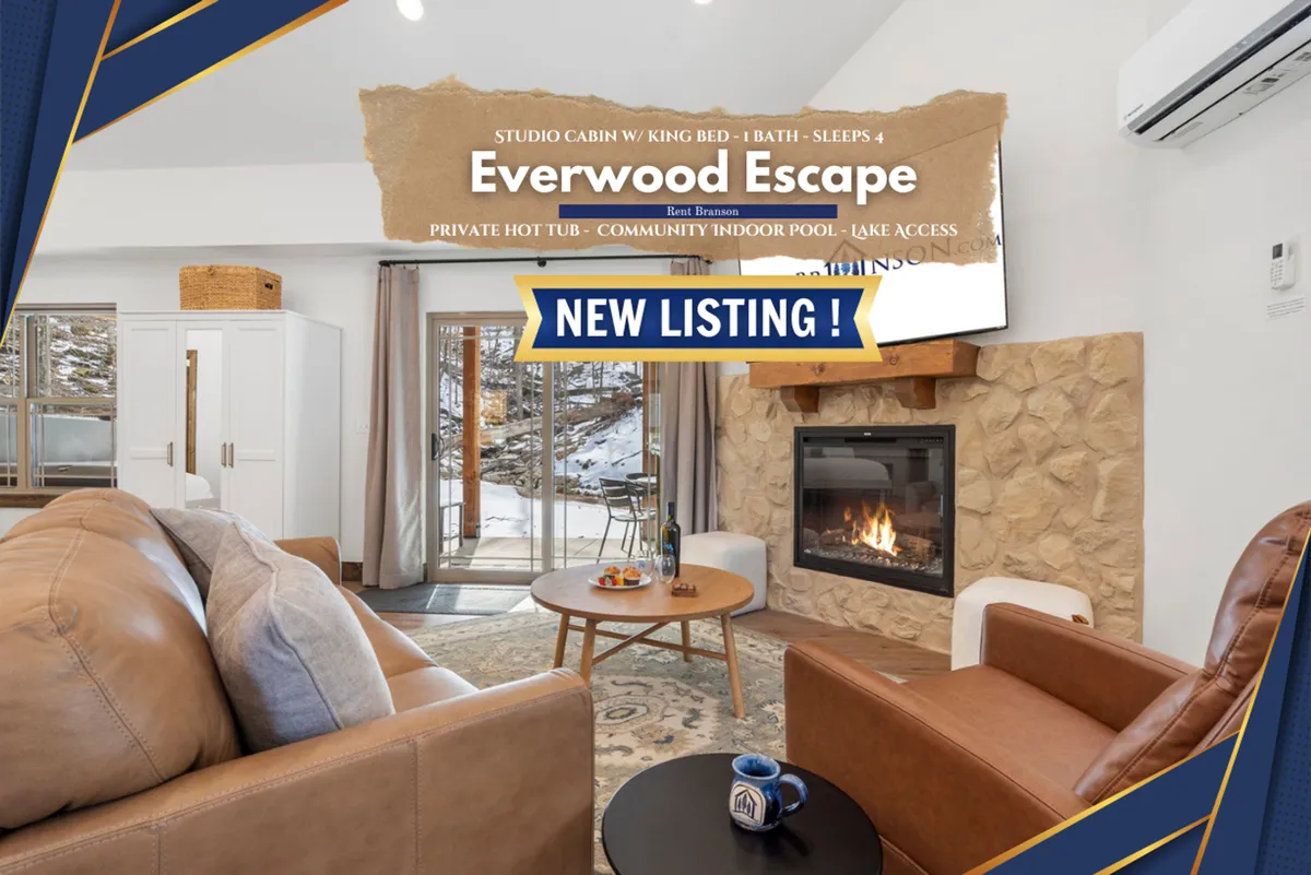 A spacious, comfortable living area with a fireplace, plush sofa, dining table, and expansive windows that frame scenic outdoor views. The scene is designed for relaxation and socializing, with natural light illuminating the wood finishes and contemporary decor.